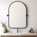 Miroir mural rotatif noir avec design arqué aux coins arrondis, quincaillerie en fer forgé