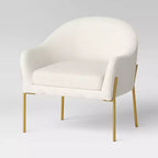 Fauteuil crapaud crème bouclette/laiton - Pieds en métal doré, dossier incurvé, fauteuil rembourré